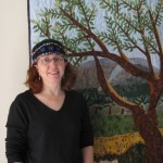 Cindy in front of Kibbutz quilt