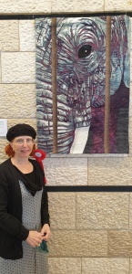 Photo of Caged In with artist and 1st place ribbon